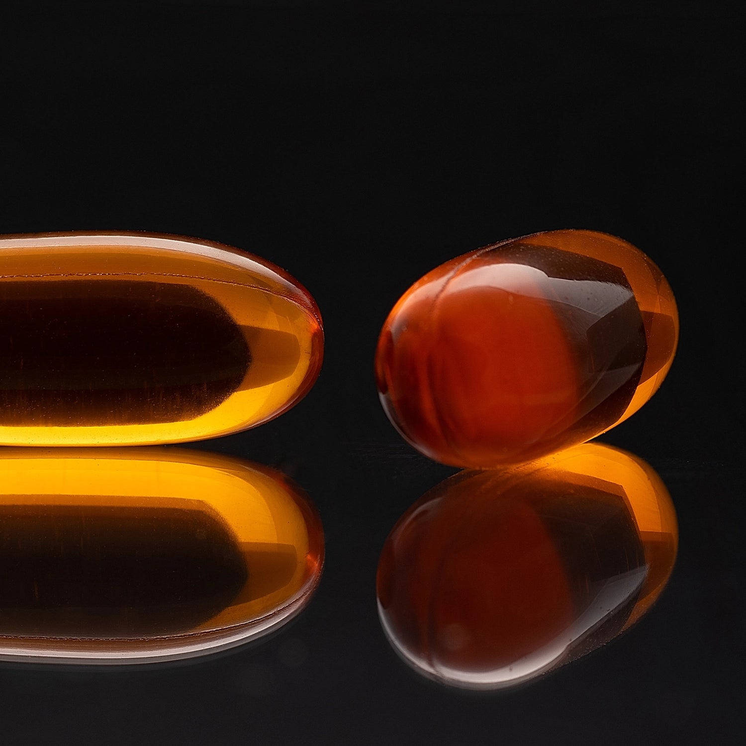 HTB Rejuvenate supplement bottle with capsules and wooden backdrop.